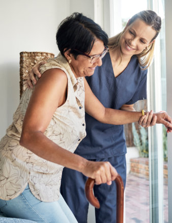 caregiver looking at senior man